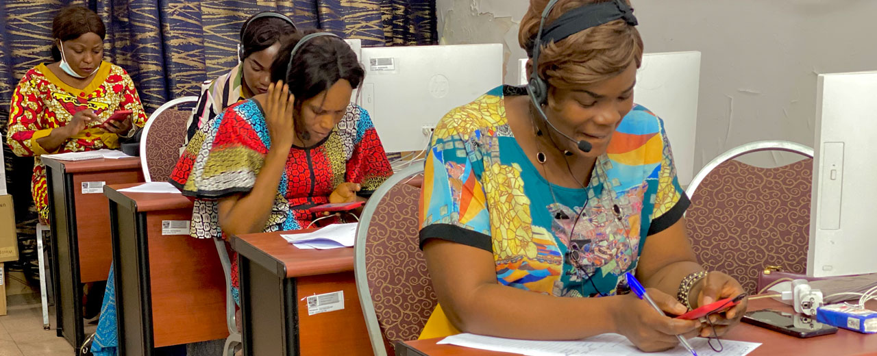 An enumerator from the RAMMPS fieldwork team in the Democratic Republic of the Congo making calls for the mobile-phone mortality survey