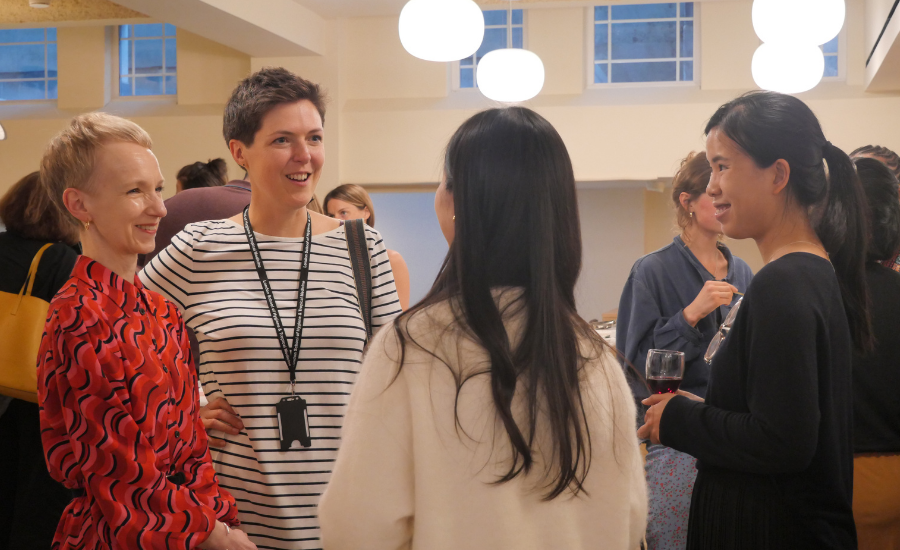 Attendees networking at the event.