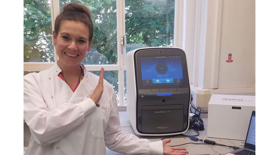 Jackie with her Quantstudio 7 Pro qPCR machine which she uses to test a variety of sample types for a panel of 30 enteric pathogens