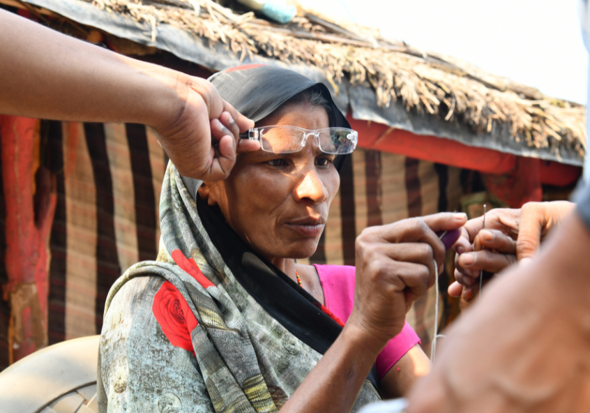 Sarojni Devi threading a needle after receiving near vision glasses. Credit: Dr Shroff's Charity Eye Hospital Sarojni Devi threading a needle after receiving near vision glasses. Credit: Dr Shroff's Charity Eye Hospital