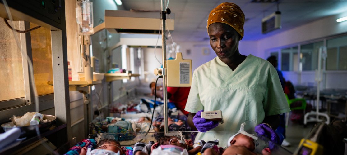 Nurse checking on babies in the maternity unit