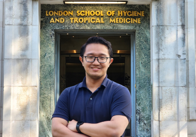 Syarmine, standing outside of LSHTM Keppel Street Building