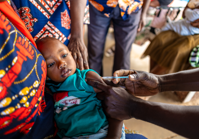 A nurse giving an injection to a baby