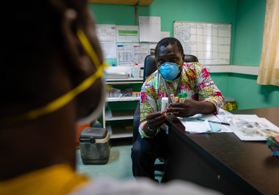 Doctor talking to Patient in a closed room