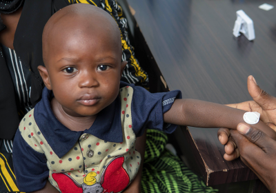 A young Gambian child shown with a microarray patch applied to the wrist. Credit: MRC Unit The Gambia at LSHTM