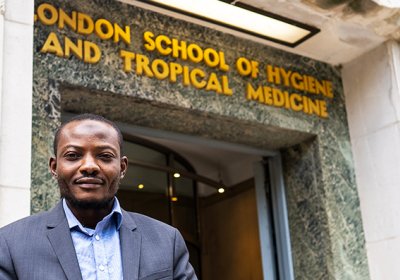Muftau stands outside the LSHTM entrance on Keppel Street