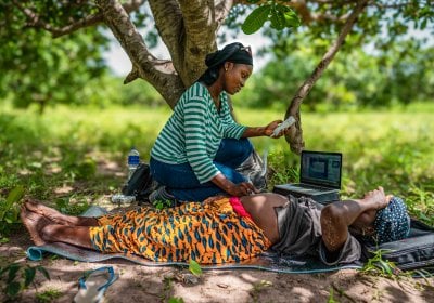 Field worker monitoring  a pregnant woman