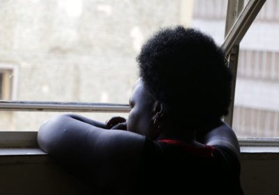 Woman leaning on window