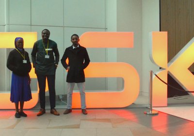 Team in front of GlaxoSmithKline logo