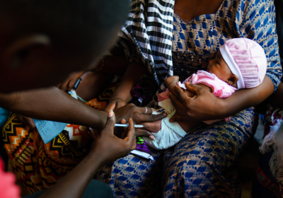 A clinician administers a dose of pneumococcal vaccine, Basse Hospital, The Gambia. Credit: Louis Leeson / LSHTM   