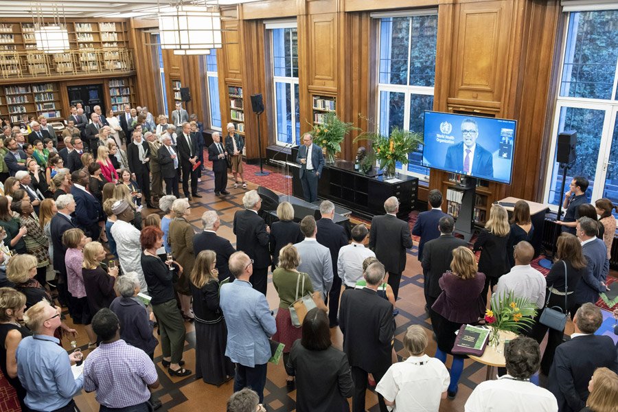Guests at a 120th anniversary event in the library Guests at a 120th anniversary event in the library