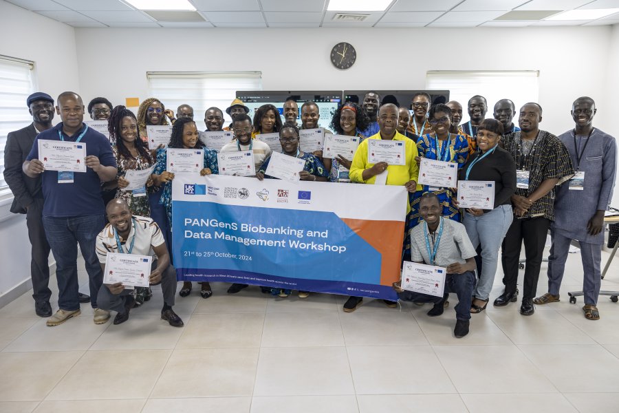 A group picture showing people holding certificates A group picture showing people holding certificates