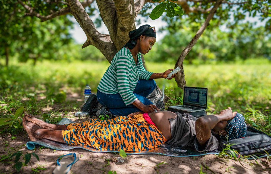Field worker monitoring a pregnant woman Field worker monitoring a pregnant woman