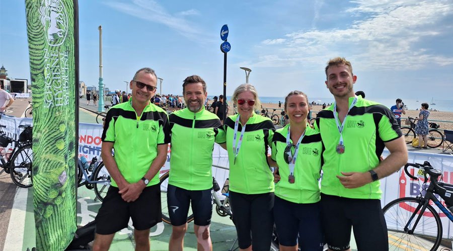 Members of the 10:00 start group triumphantly arrive in Brighton: LSHTMs Director Liam, friend of LSHTM Eduardo Gomes, LSHTM Professor Tanya Marchant, former student Zoe Solt (MSc Nutrition for Global Health, 2021) and her partner Jake Whelan Group photo of riders in London to Brighton after ride