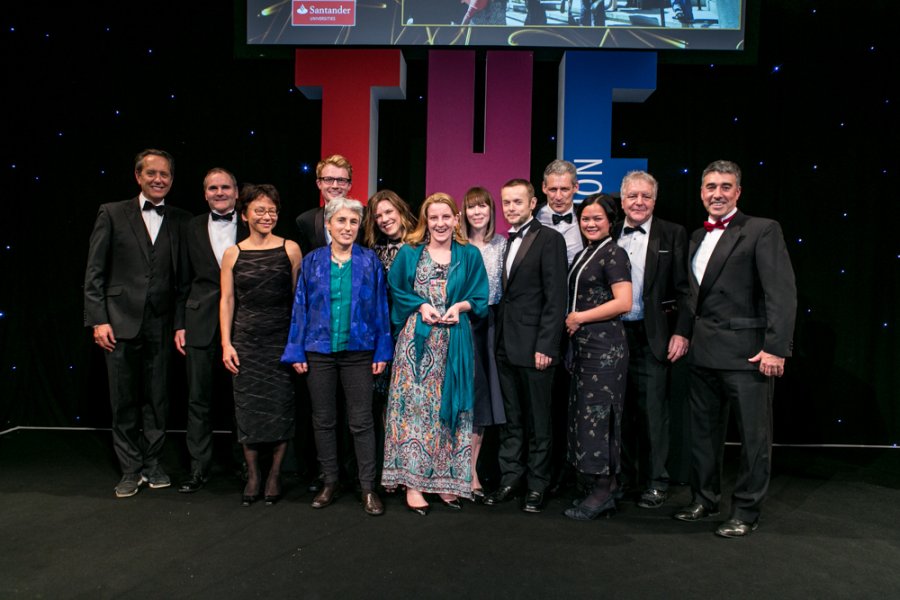 School staff collect the award