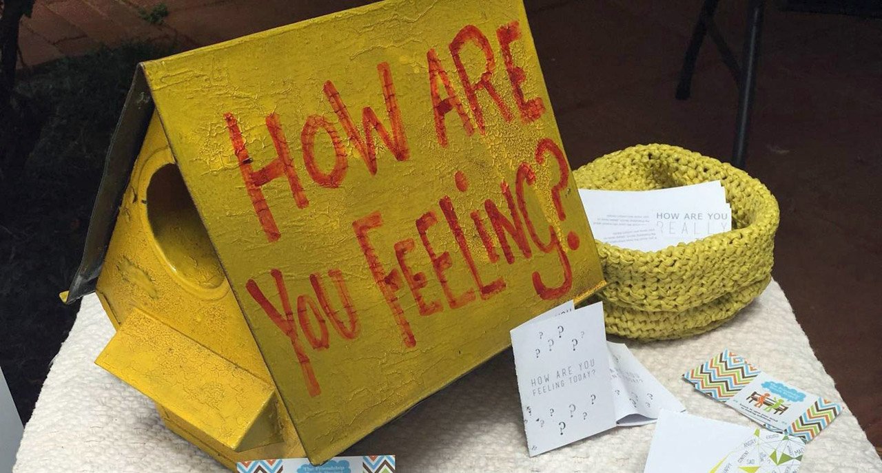 How are you feeling sign on a table How are you feeling sign on a table