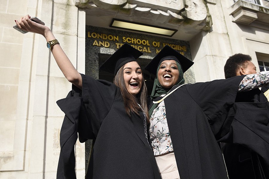 Pair of graduates celebrating outside Keppel Street