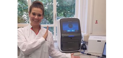 Jackie with her Quantstudio 7 Pro qPCR machine which she uses to test a variety of sample types for a panel of 30 enteric pathogens