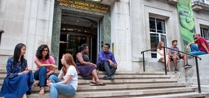 MSc students sat on stairs outside Keppel Street 